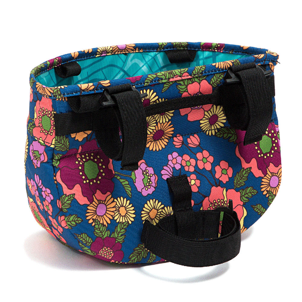 Colorful floral-patterned handlebar bag with black straps on a white background