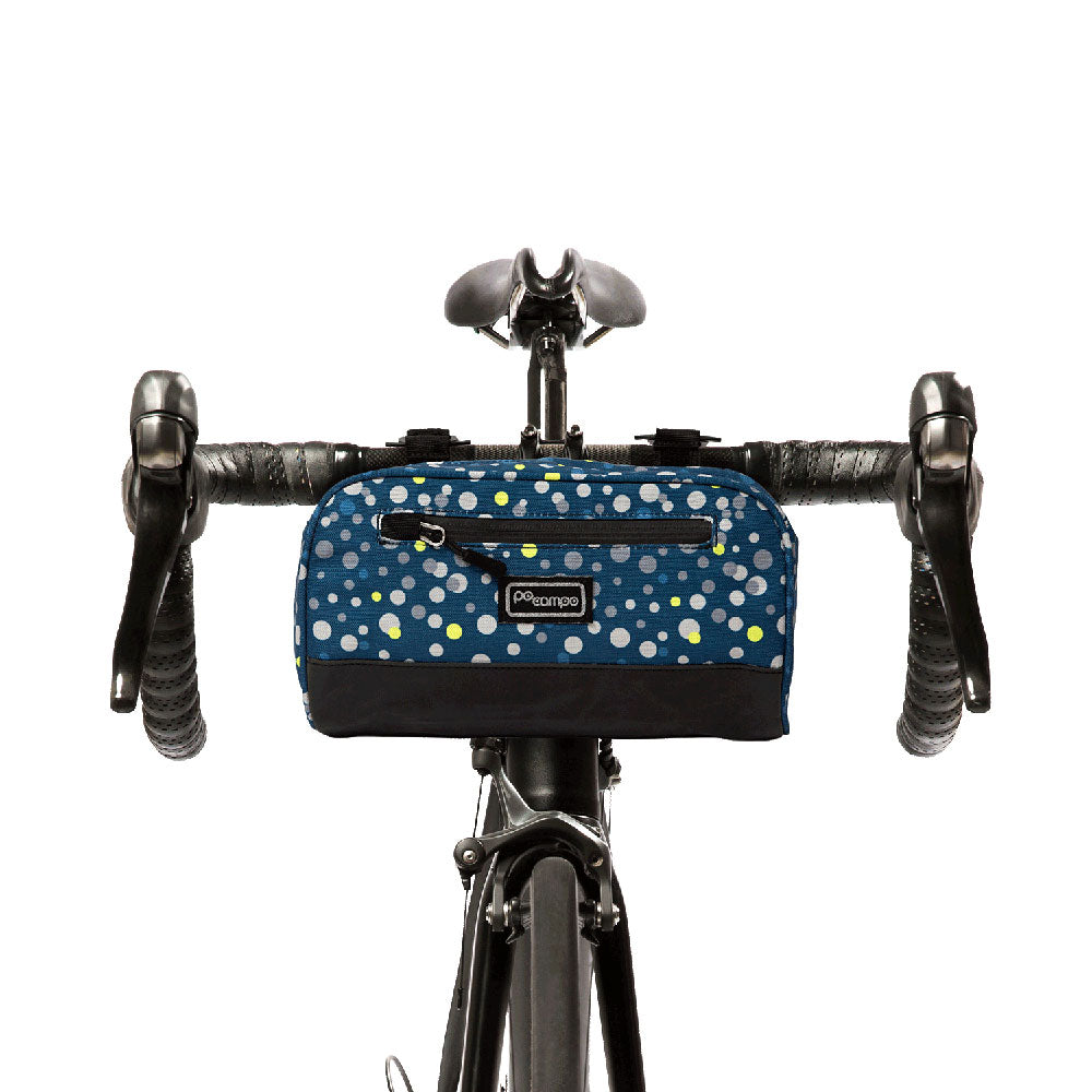 Bicycle handlebar bag with blue polka dot design on a white background
