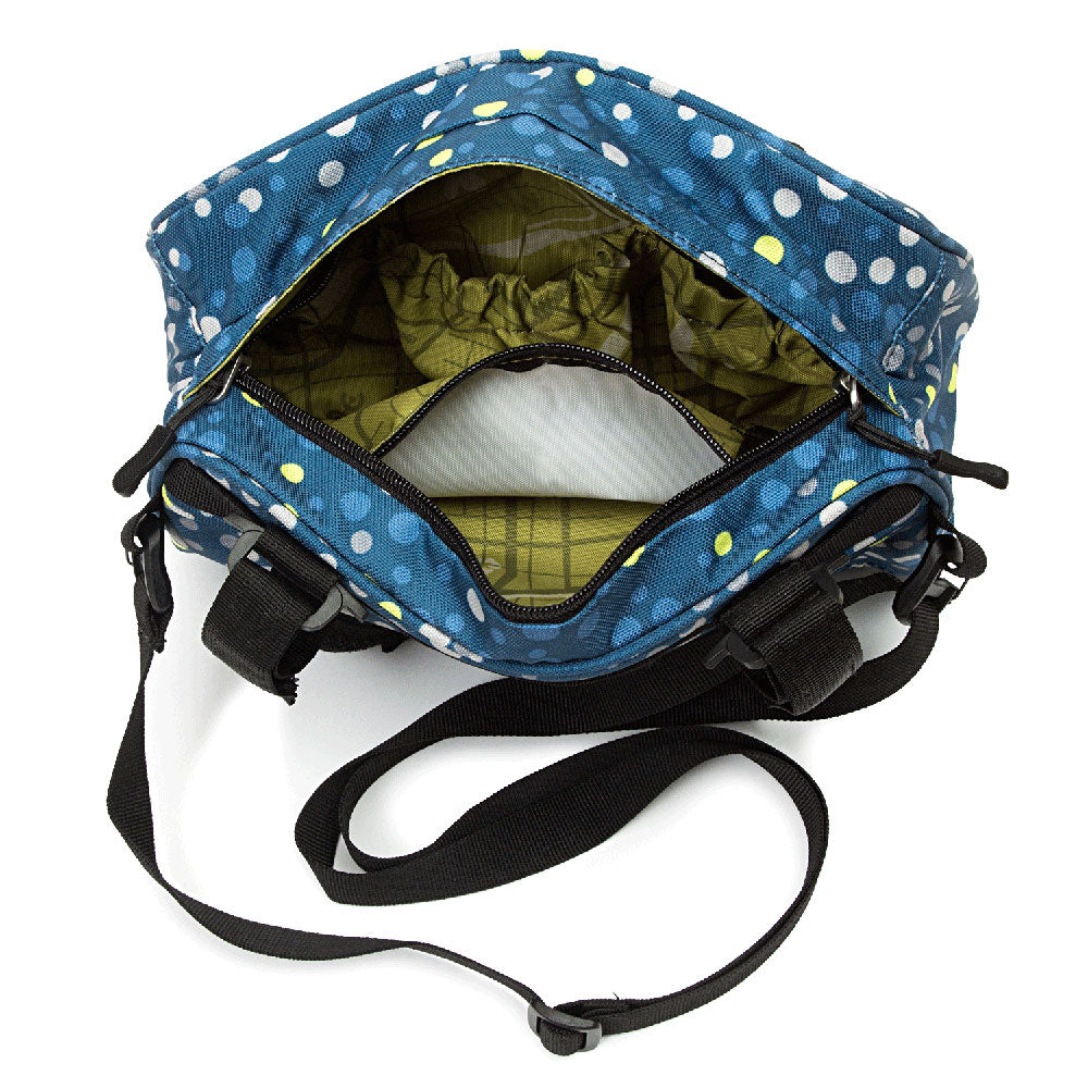 Blue polka dot handlebar bag with black straps on a white background