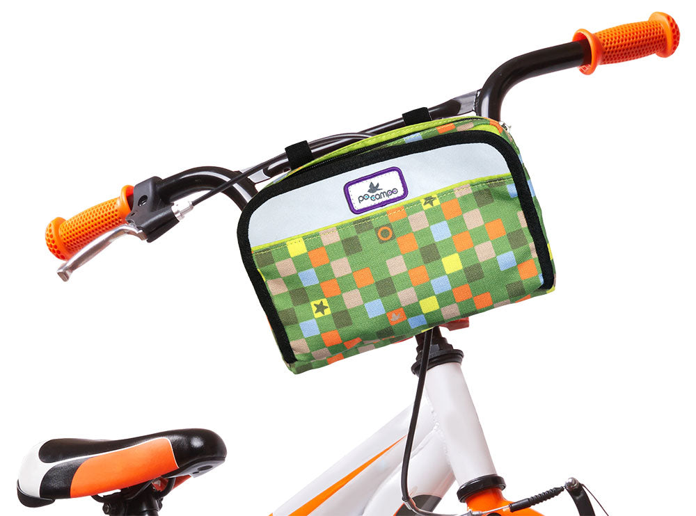 Children's bicycle with a colorful handlebar bag on a white background