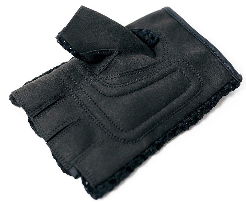 Black half-finger glove on a white background