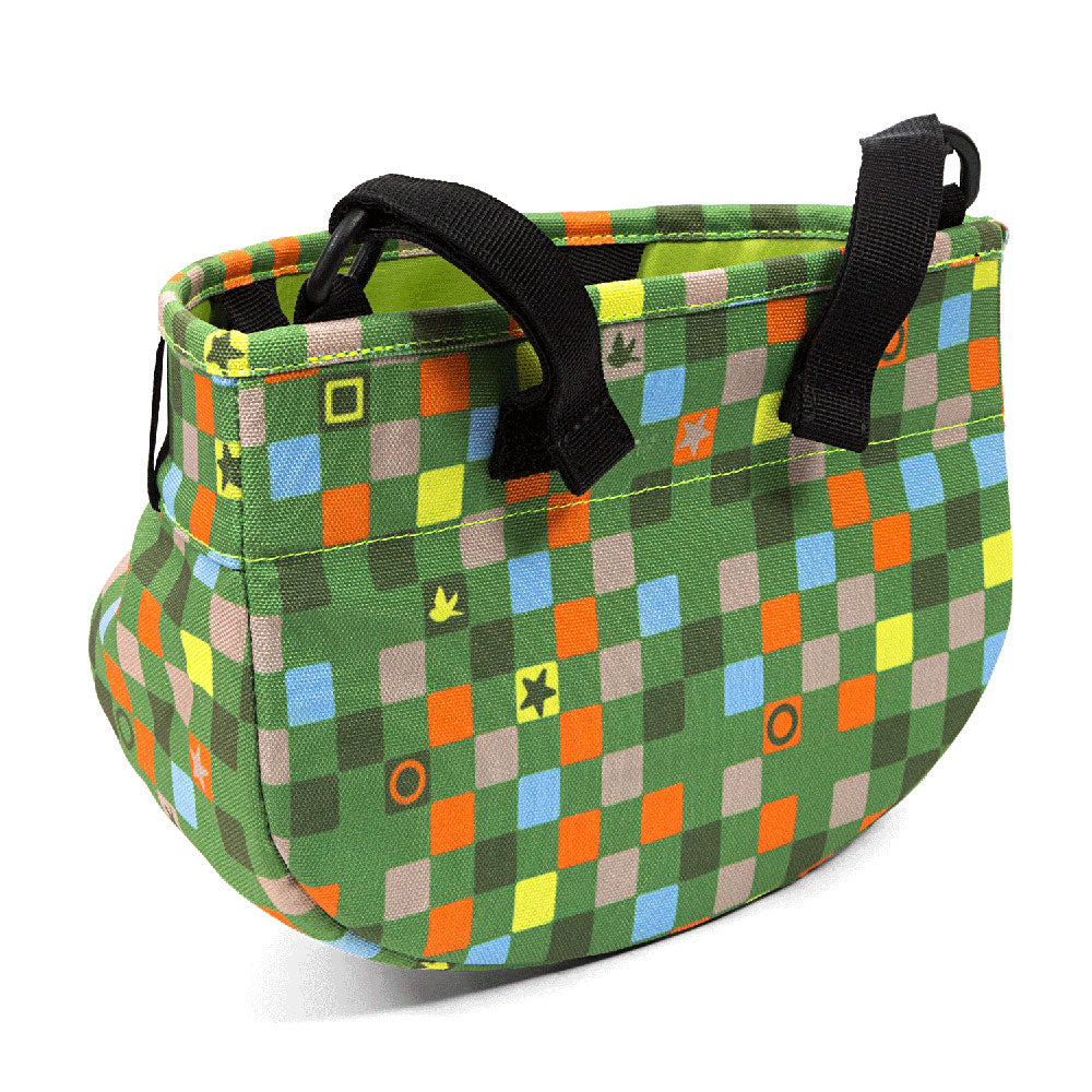 Colorful patterned bag with black straps on a white background