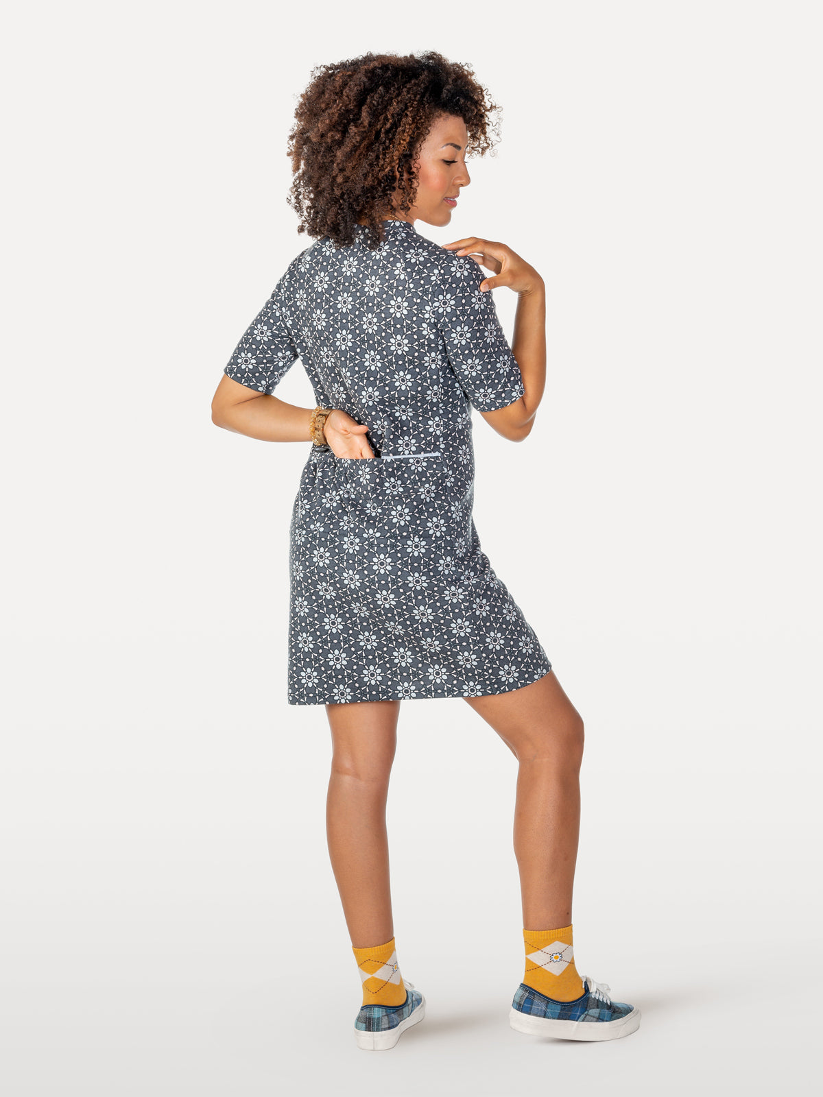 Yellow-budded daisies cycling dress showing reflective strip on back with pockets