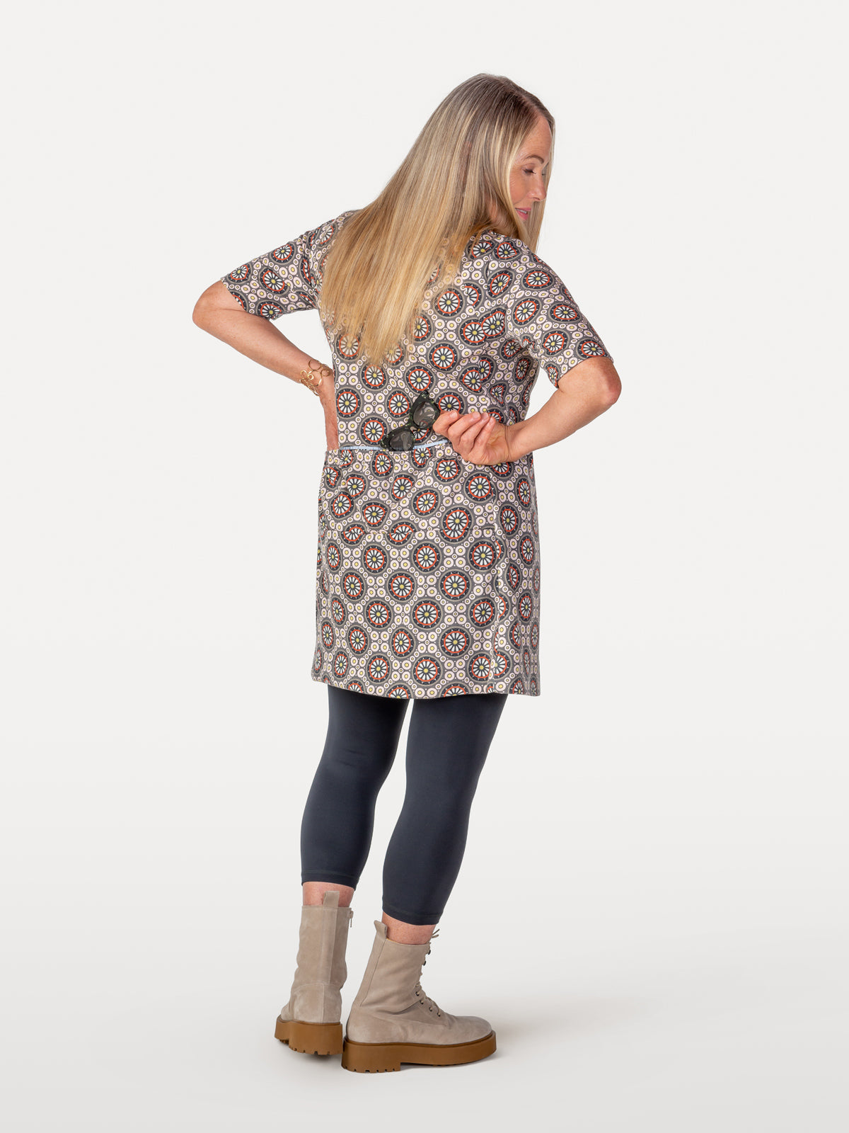 Cycling dress with spoke pattern red and pink showing reflective strip over back packets