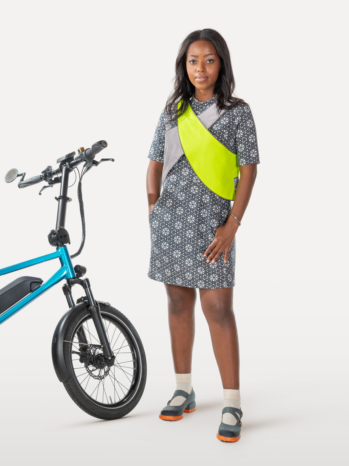 High visibility crisscross vest over spoke story cycling dress