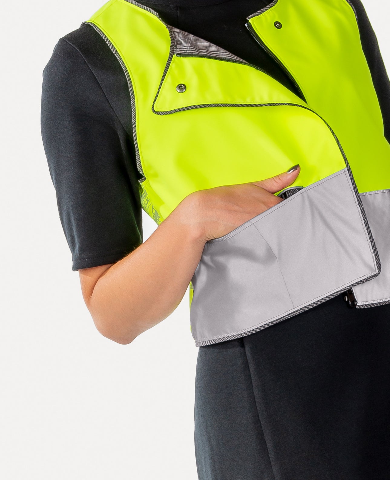 Close up of reflective vest showing hidden pocket for phone or keys or cards