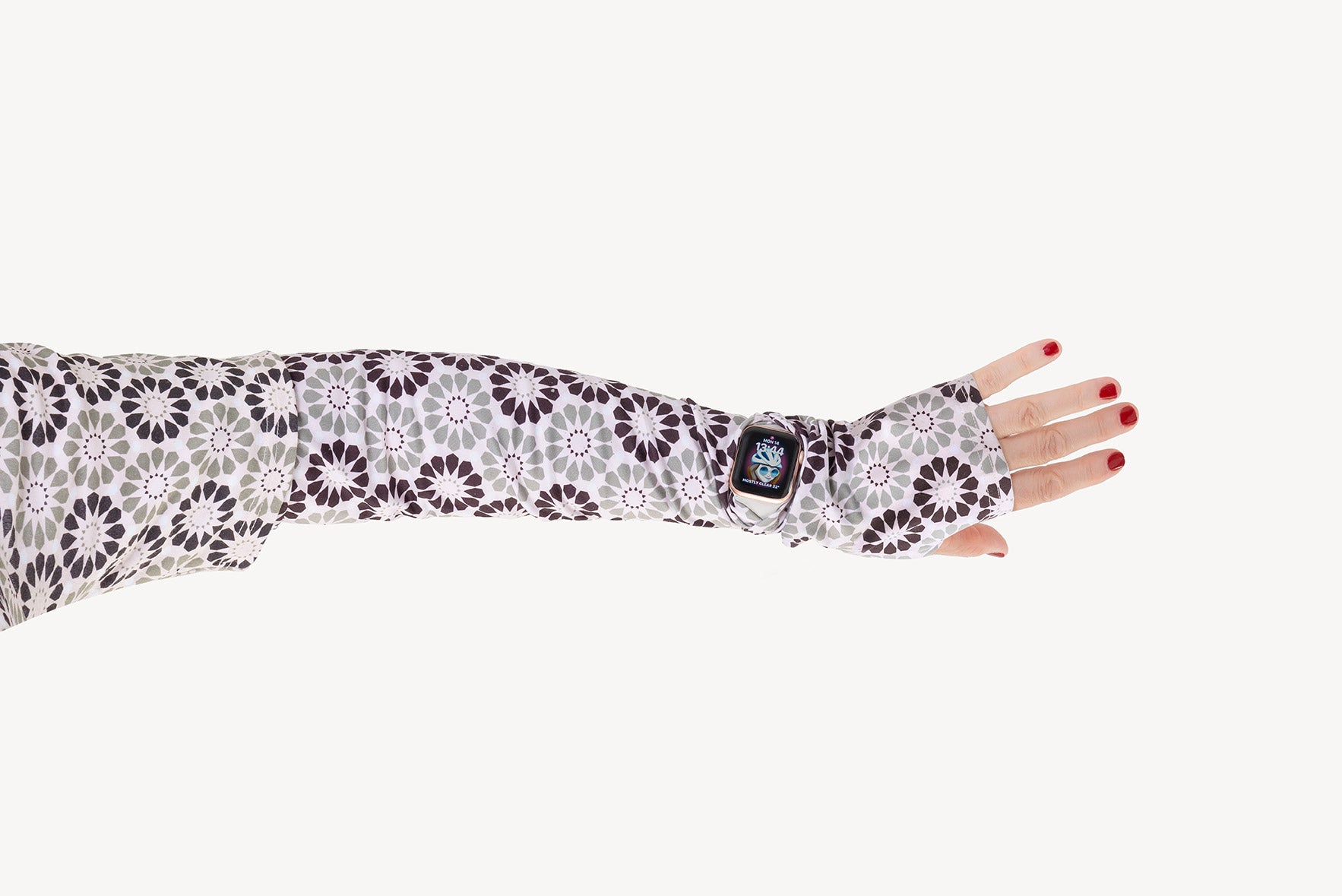 Floral patterned arm sleeve worn on a white background
