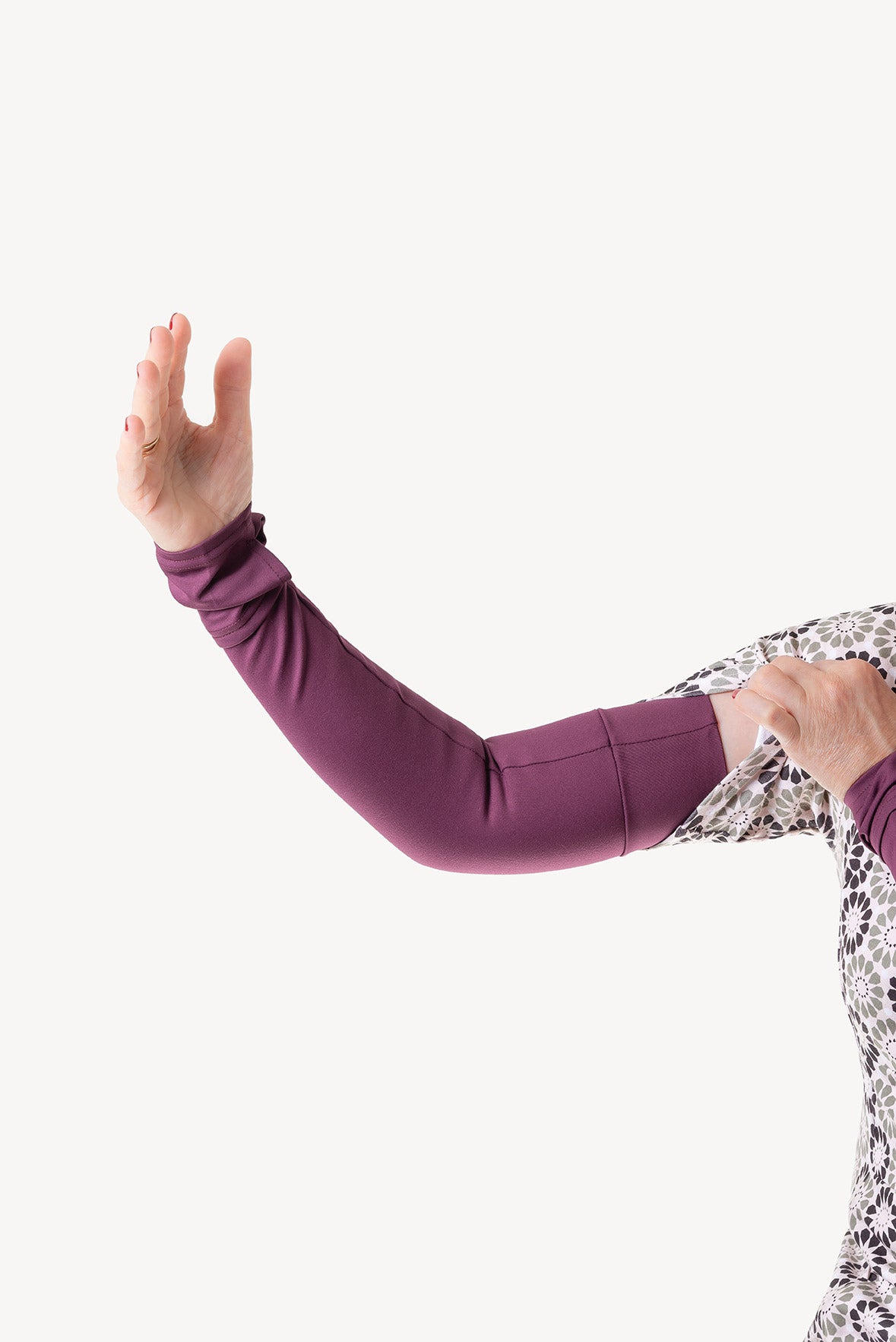 Person wearing purple leggings with a white background