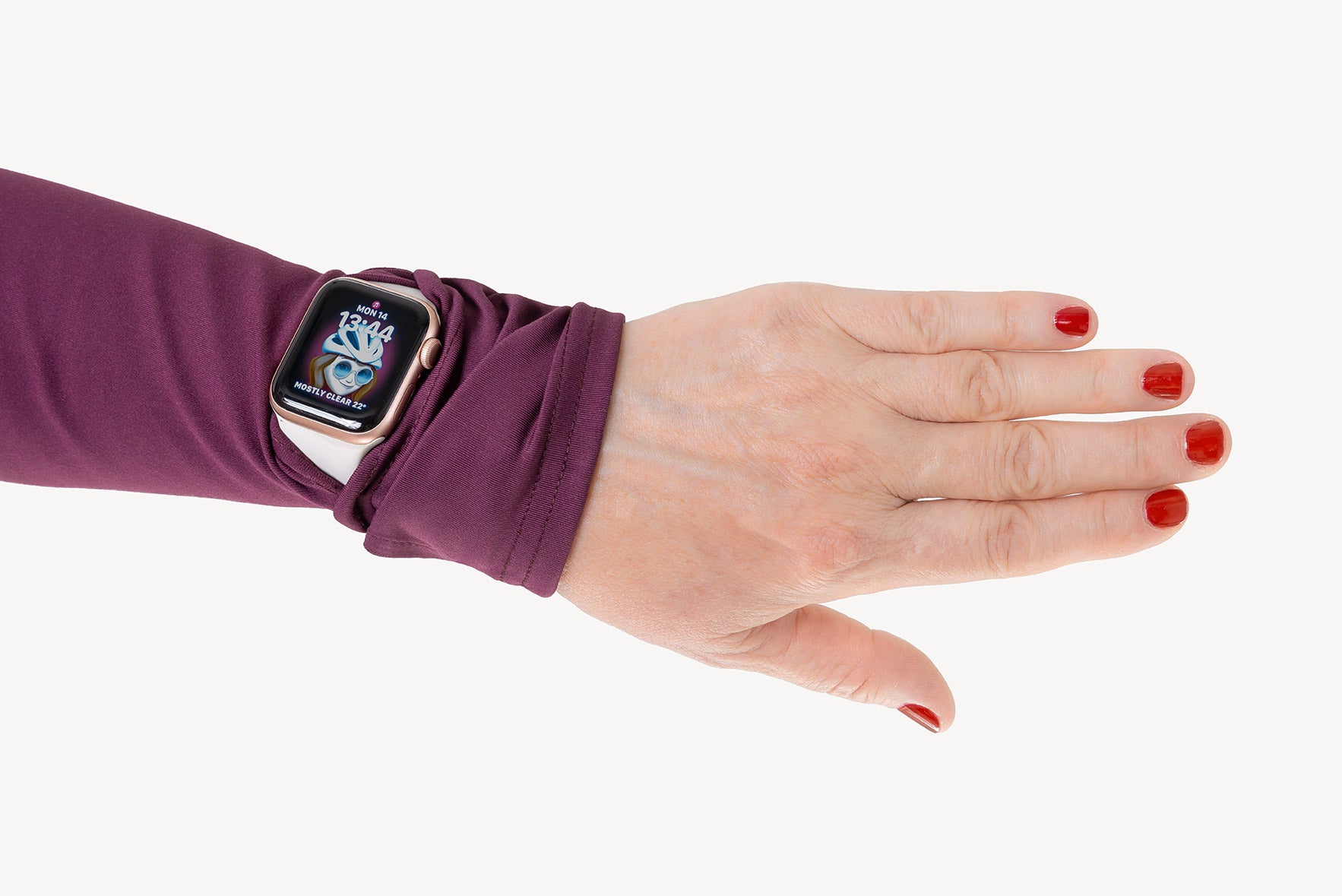 Hand wearing a smartwatch with a purple arm warmer on a white background