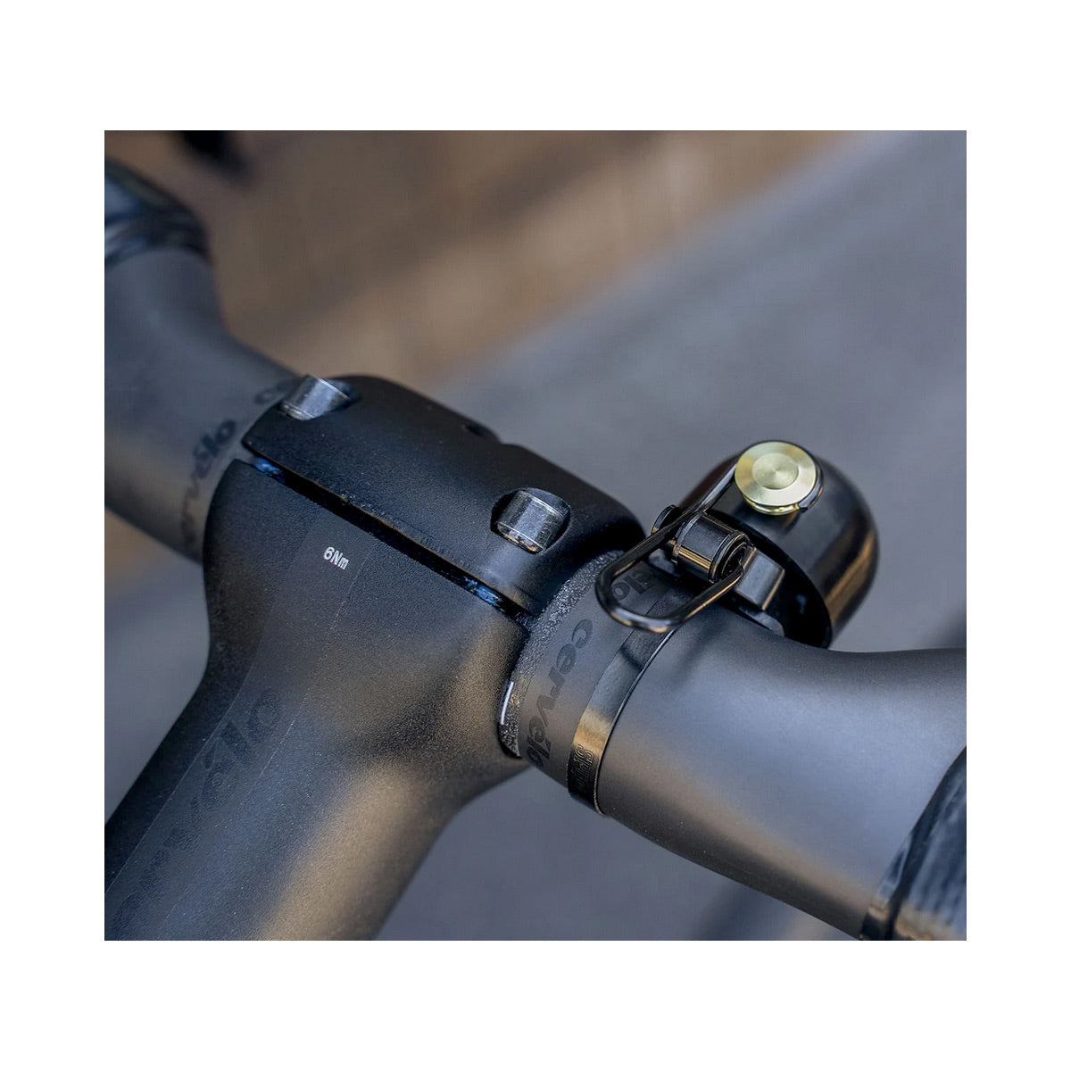 Close-up of a bicycle handlebar with a bell attached