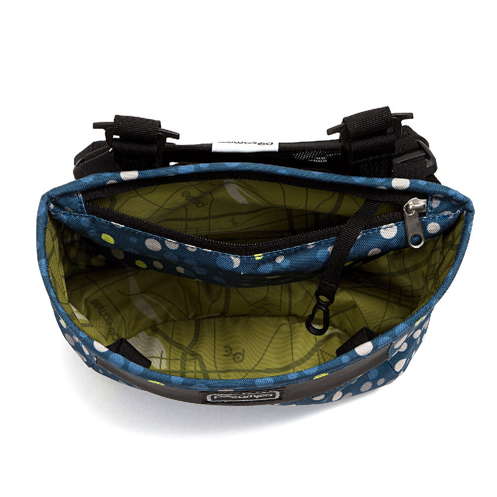 Handlebar bag with blue and white polka dot pattern on a white background