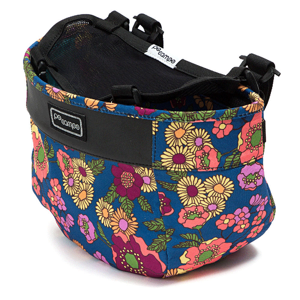 Floral-patterned bike basket with 'Po Campo' branding on a white background
