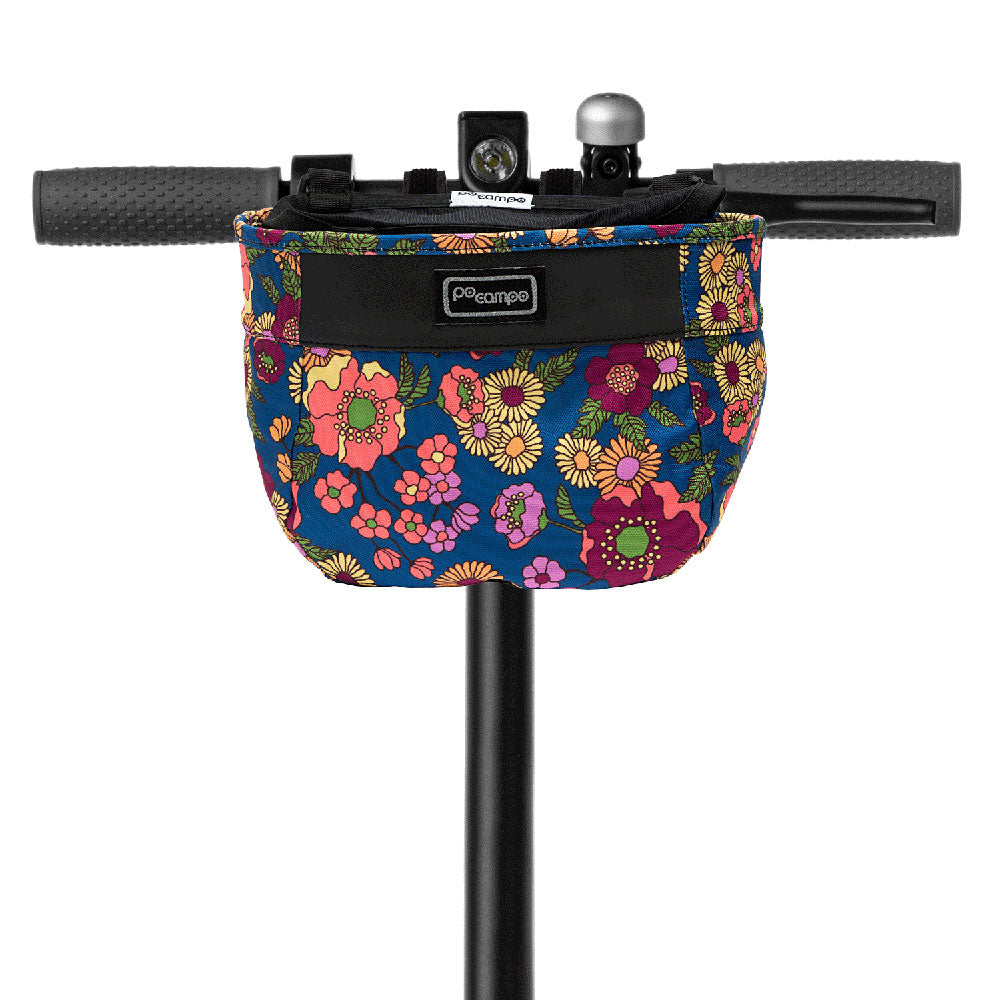 Floral-patterned scooter bag attached to a scooter handlebar on a white background