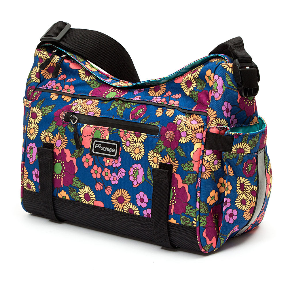 Floral-patterned bike trunk bag with black straps on a white background