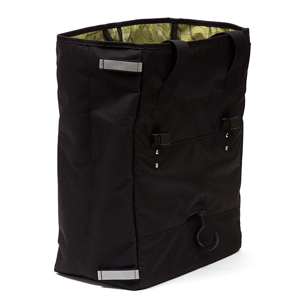 Black grocery bag pannier with reflective labels on a white background