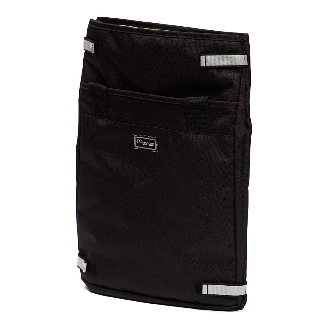Black grocery pannier with reflective accents on a white background