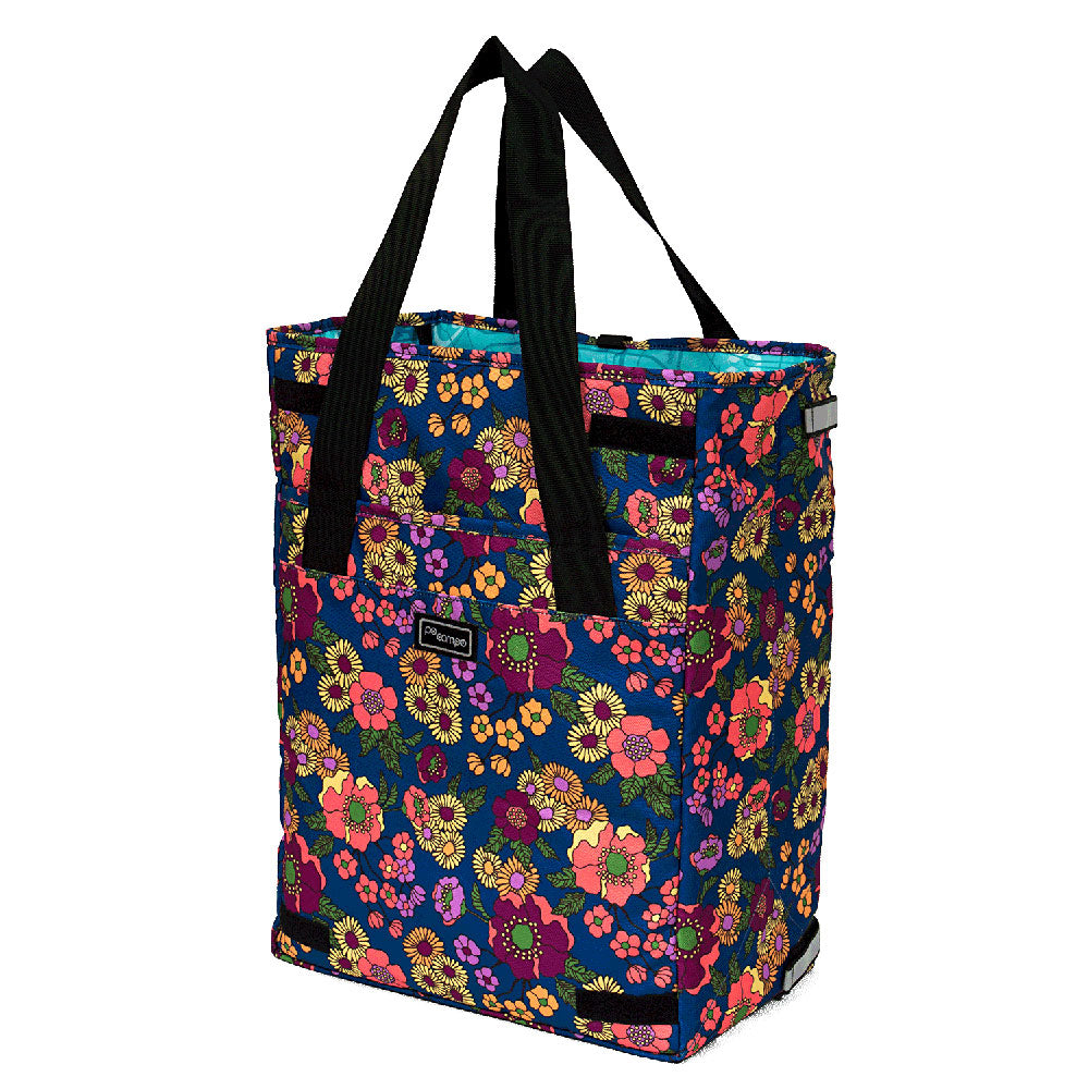 Floral-patterned pannier with black handles on a white background