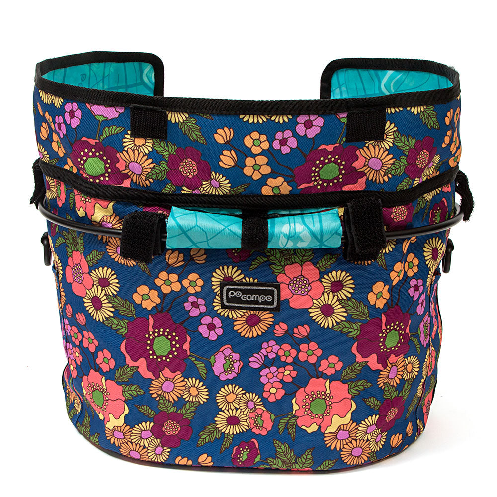 Floral-patterned bicycle basket with a visible brand logo on a white background