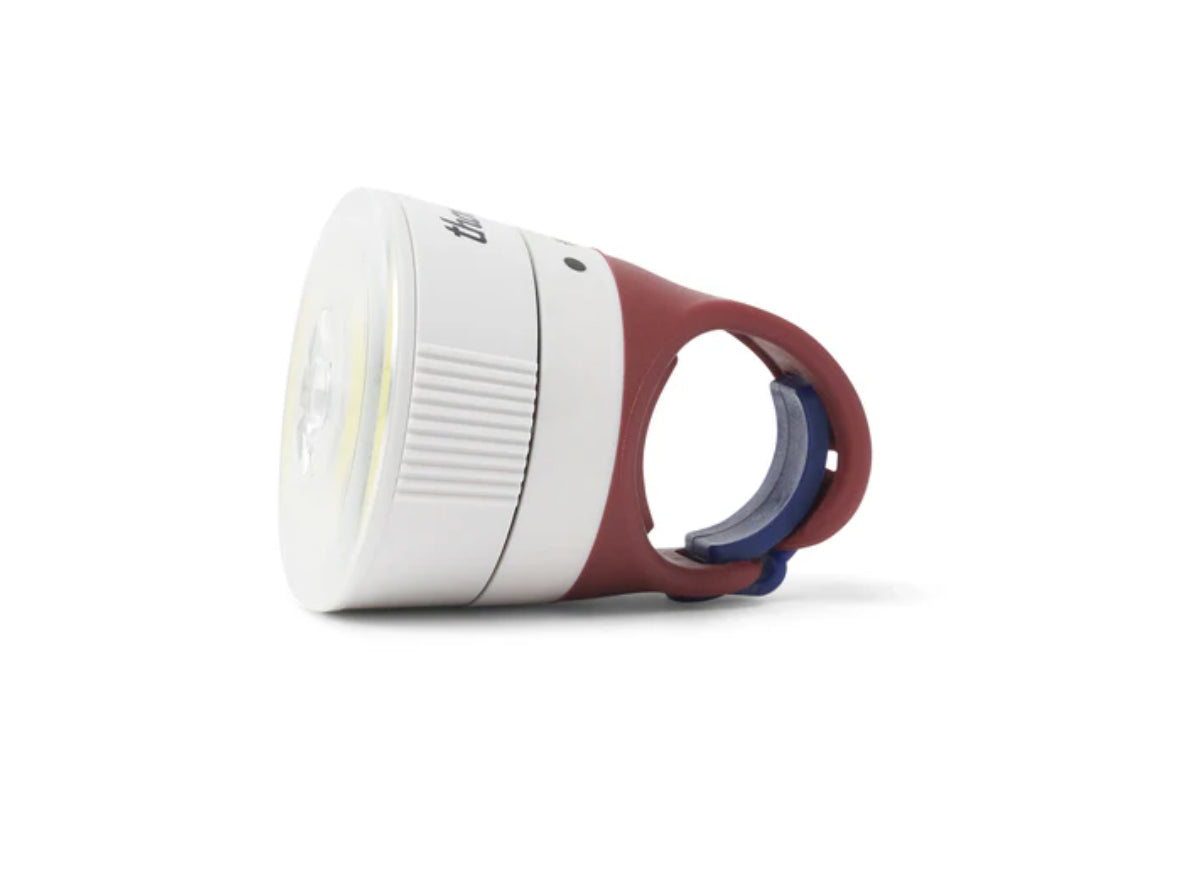 White and red 
bike light on a white background