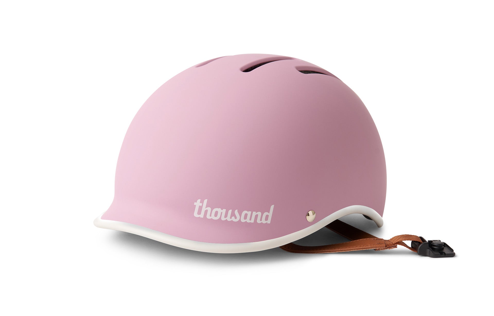 Pink helmet with brown strap on a white background
