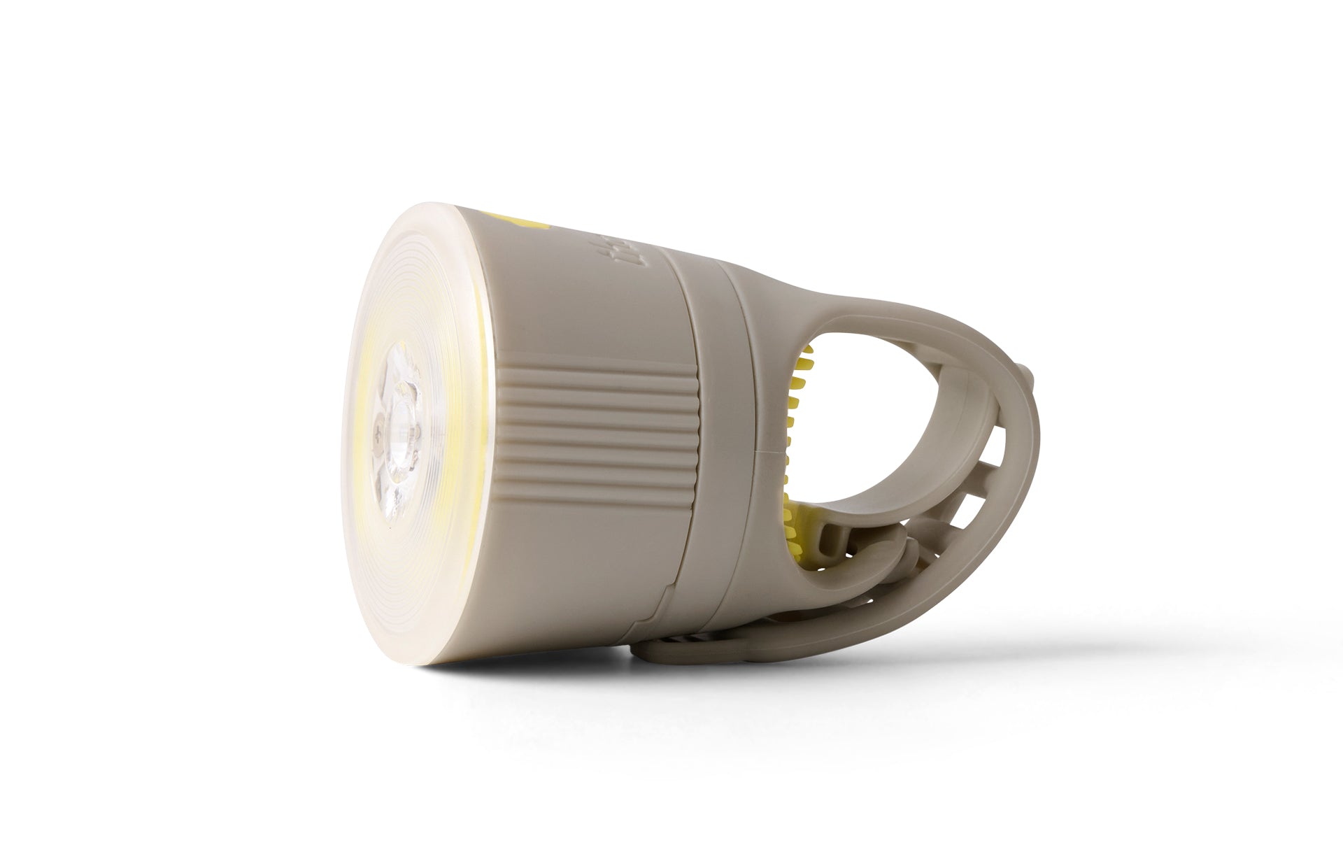 Creme coloured front bike light on a white background