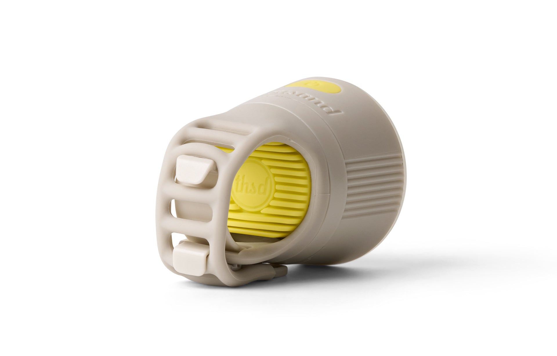 Creme and yellow cylindrical front bike light on a white background