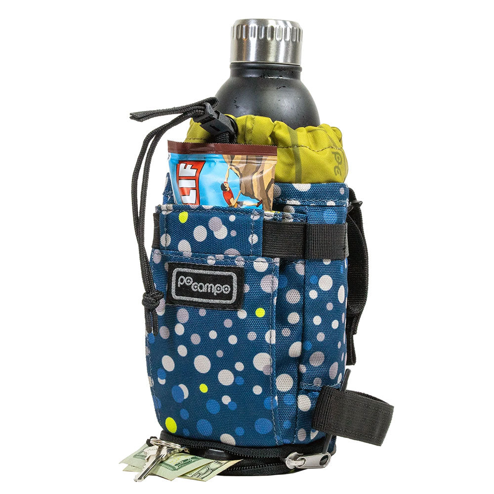 Blue polka dot bicycle water bottle holder with a water bottle and snacks on a white background