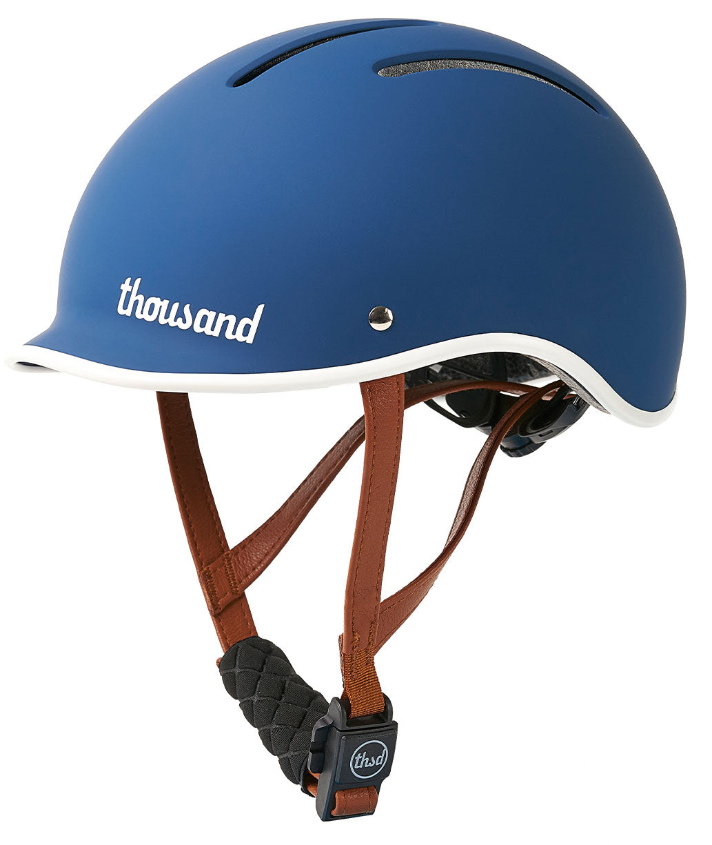 Blue helmet with brown straps on a white background