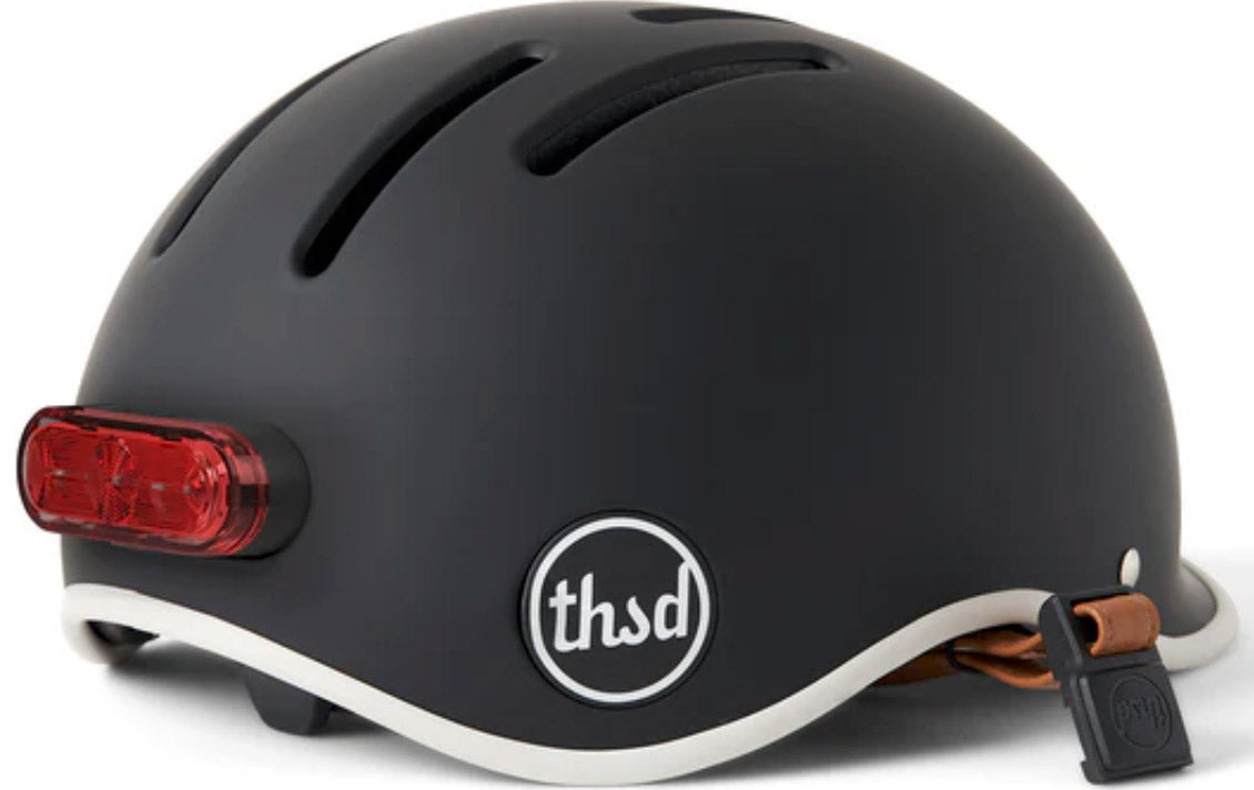 Grey helmet with red tail light magnetically attached 
