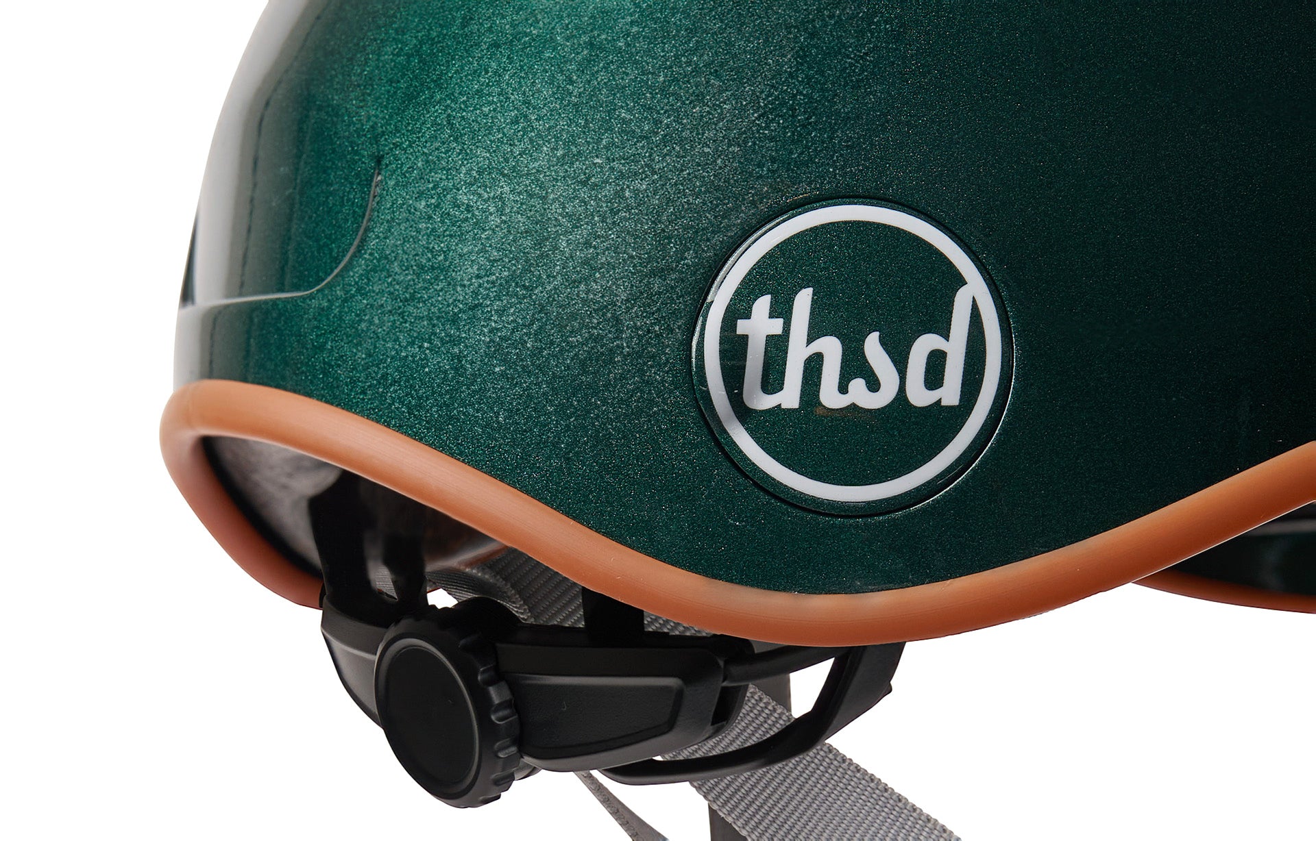 Green helmet with brown rim and 'thsd' logo on a white background