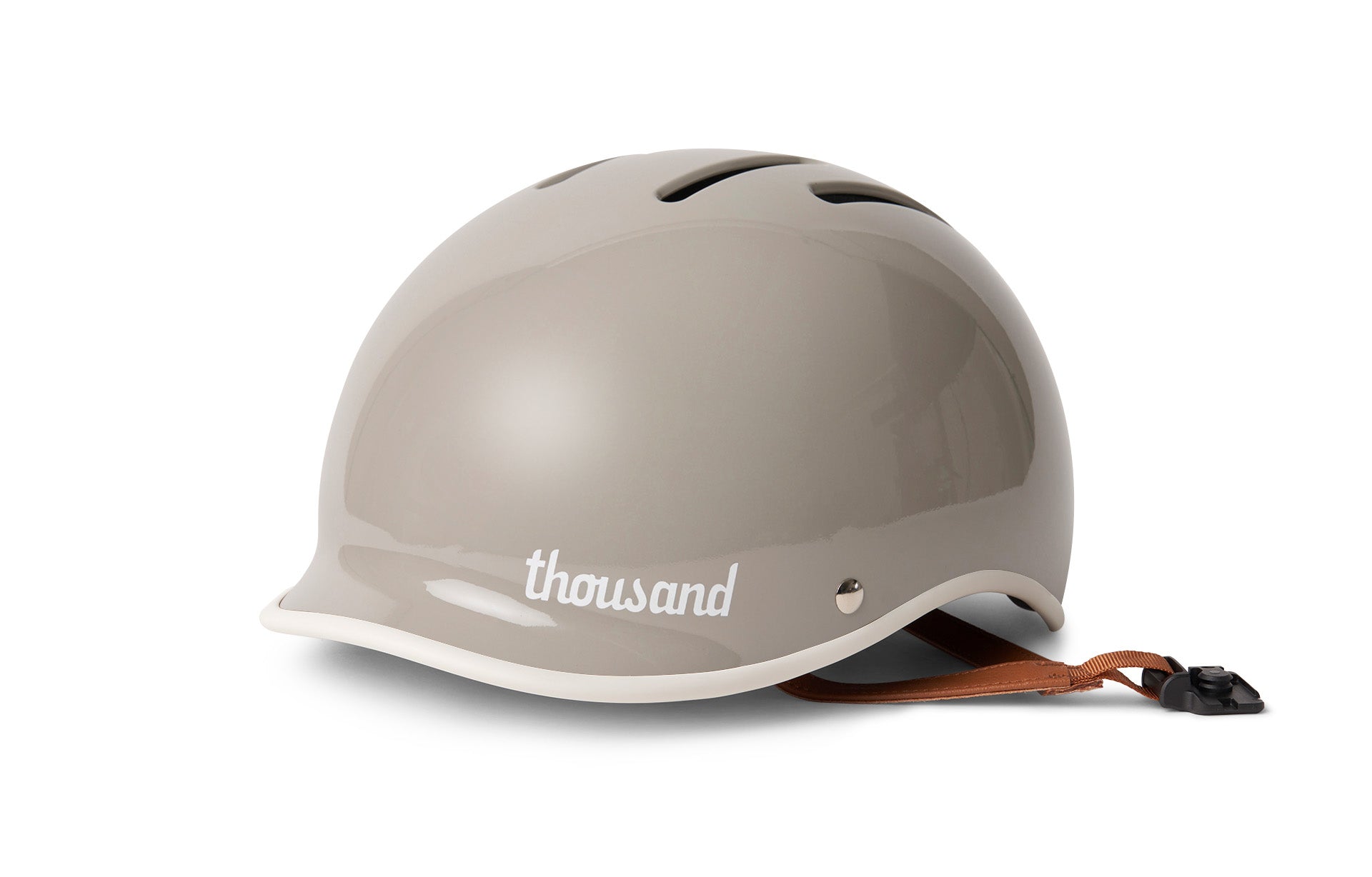 Dove grey helmet with 'thousand' branding on a white background
