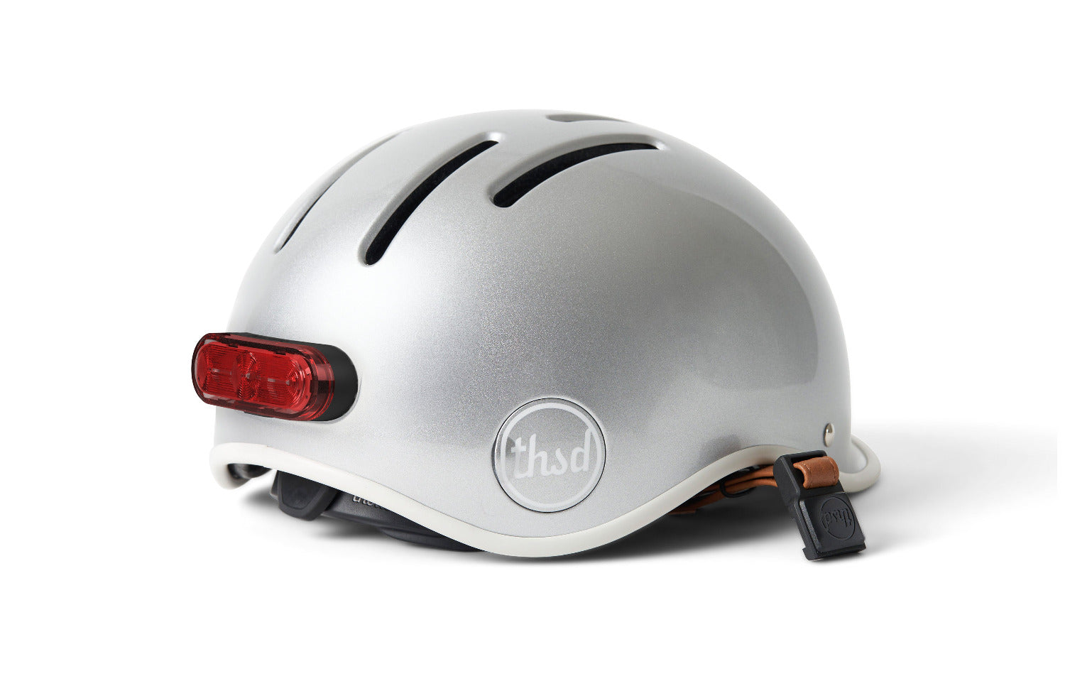 Silver helmet with a magnetic red light on back of helmet.