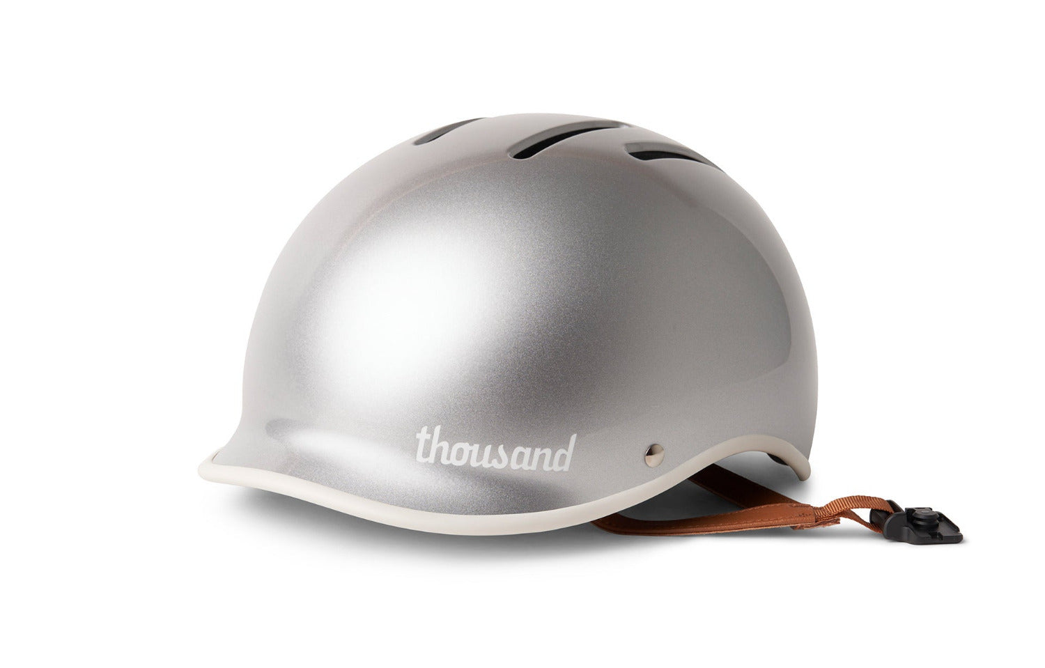 Silver helmet with brown leather strap on a silver background