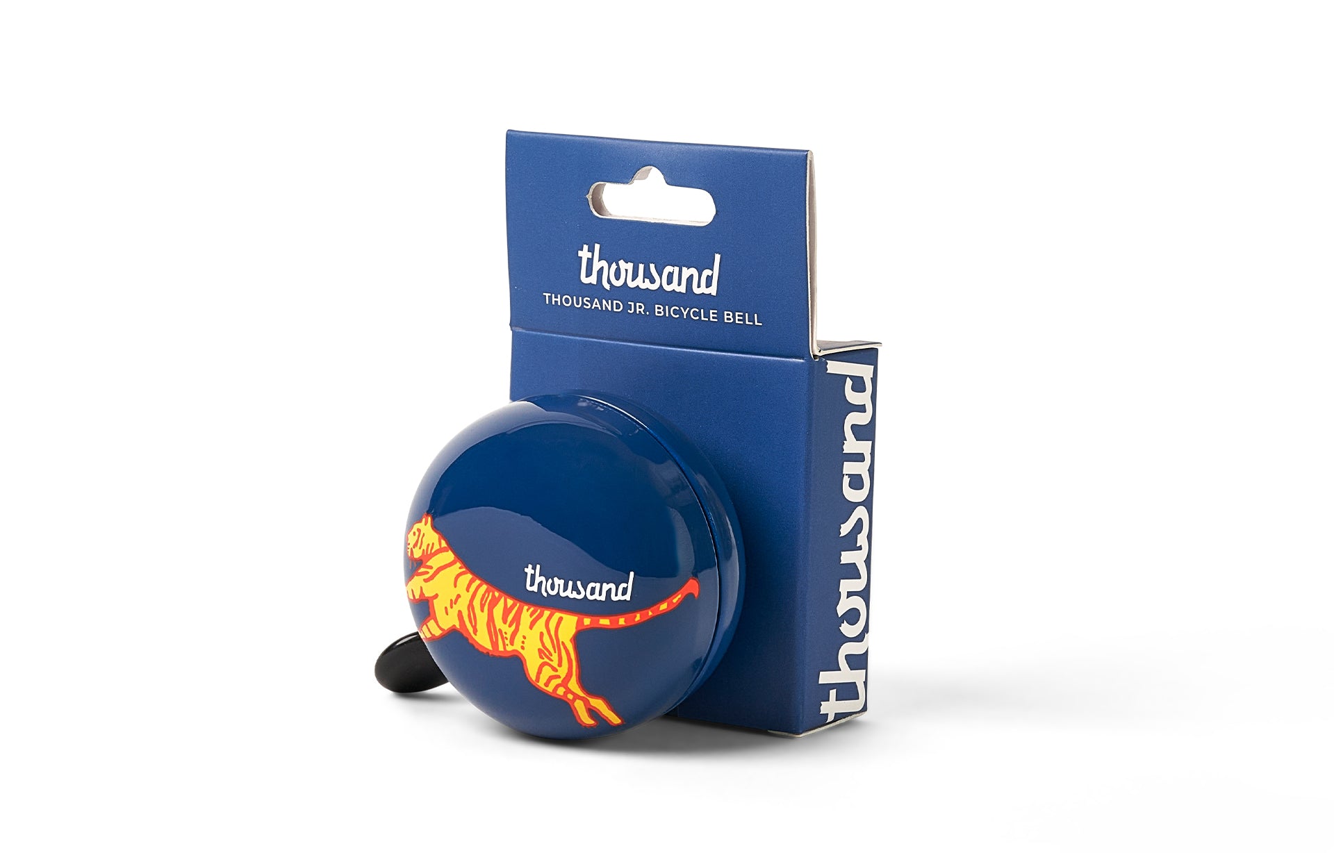 Blue bicycle bell with orange tiger design and packaging on a white background