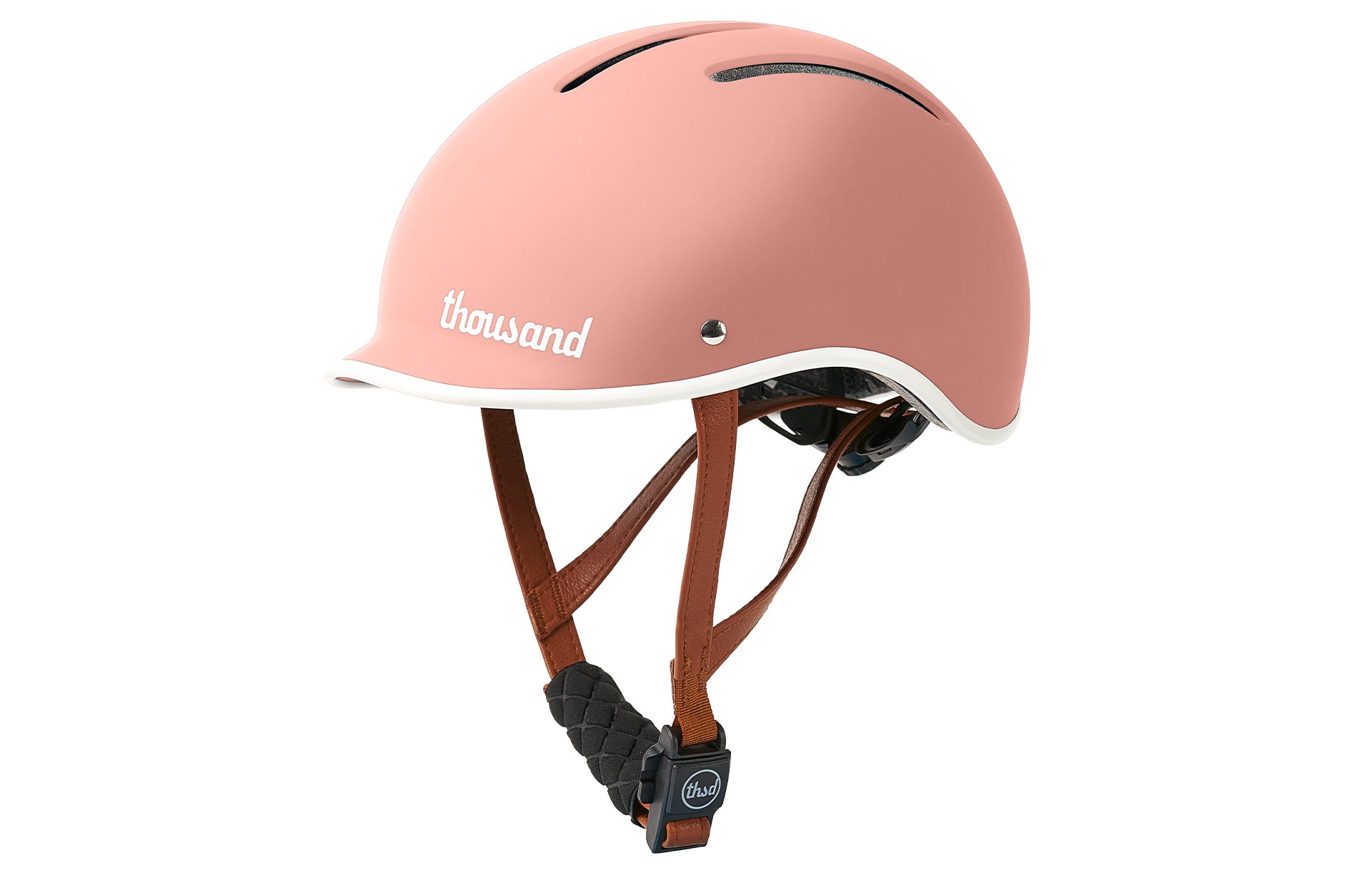 Pink helmet with brown straps on a white background
