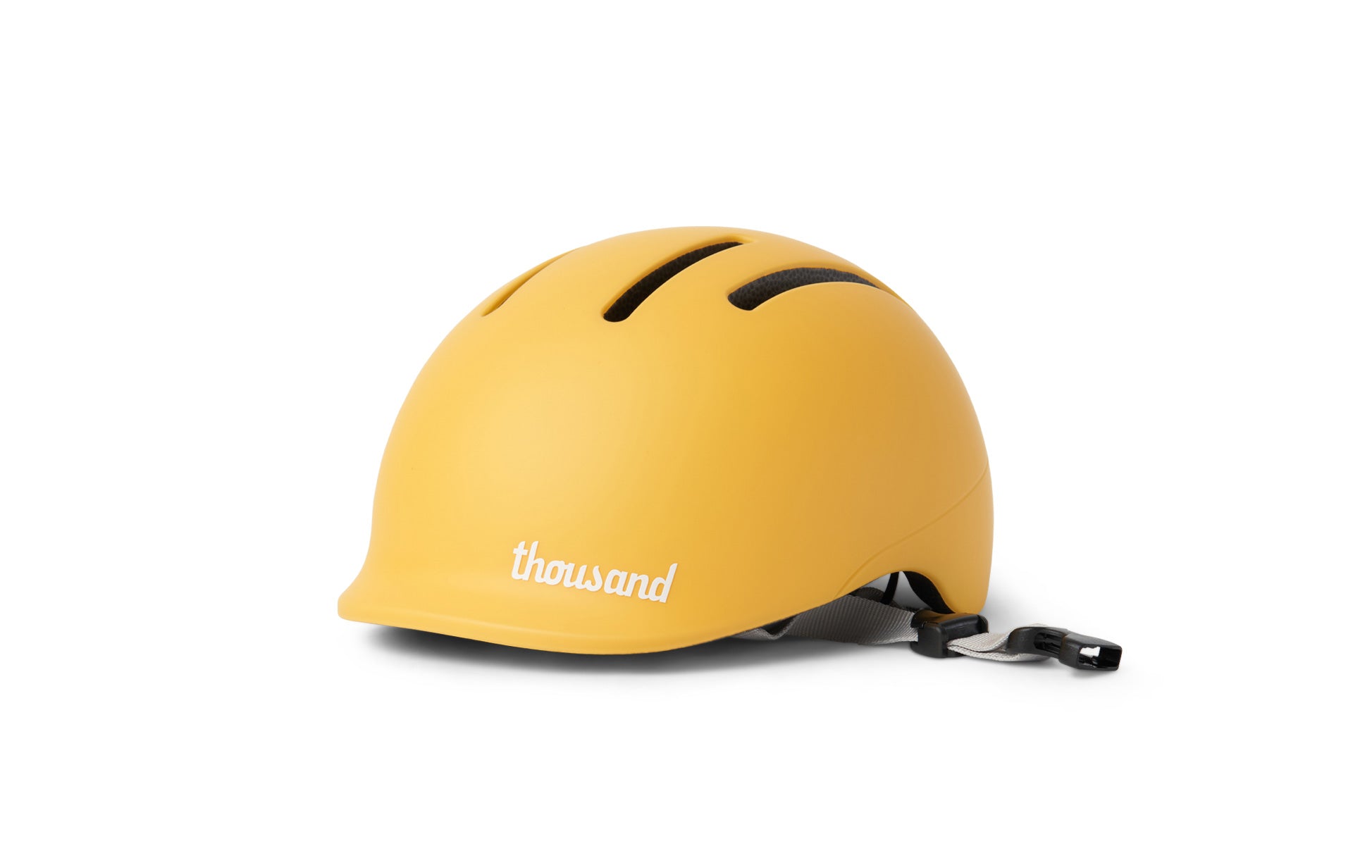 Yellow helmet with 'thousand' branding on a white background