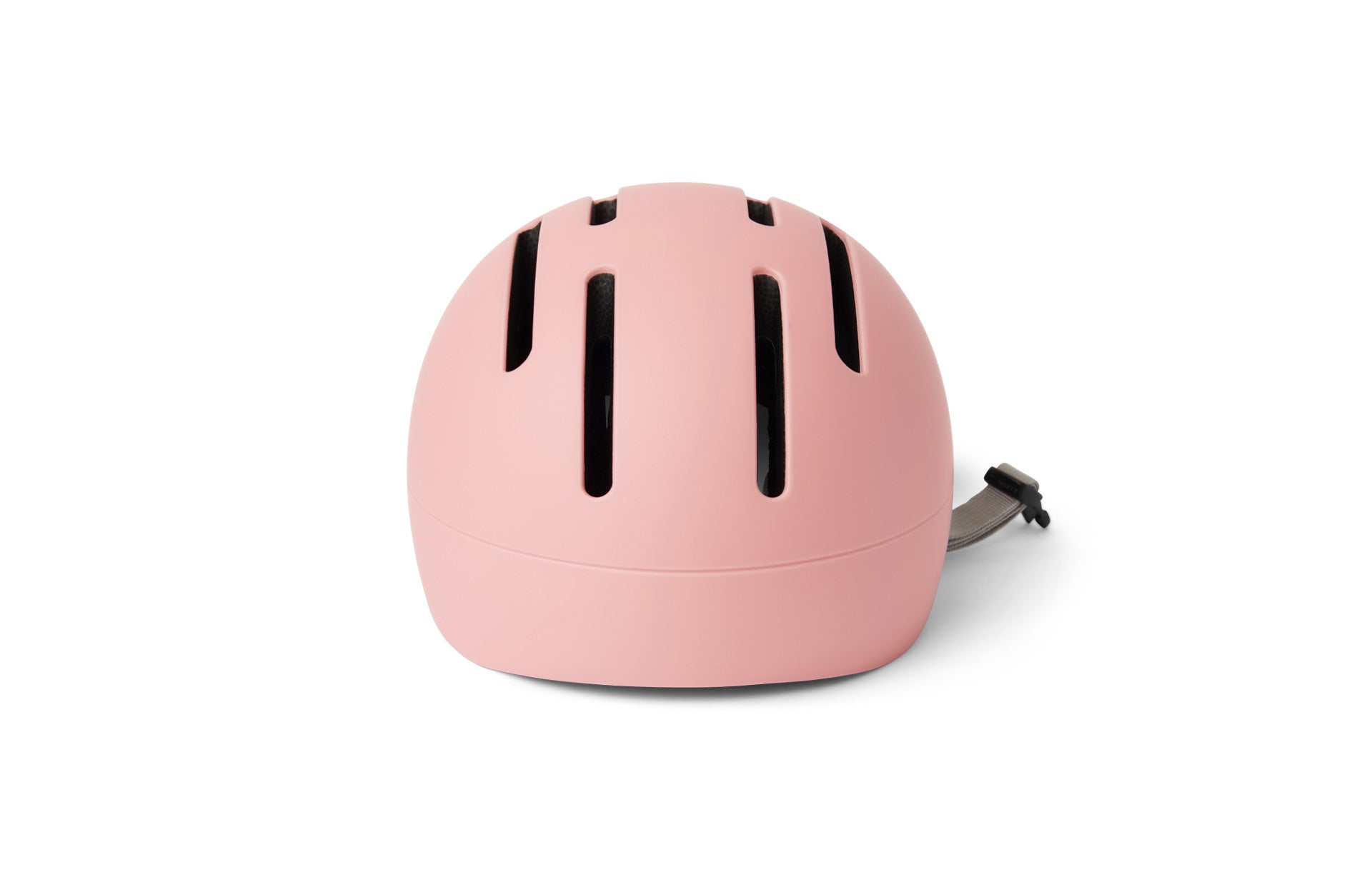 Pink helmet with black ventilation strips on a white background