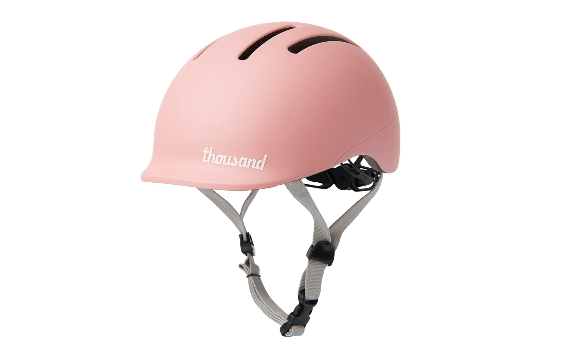 Pink helmet with 'thousand' branding on a white background