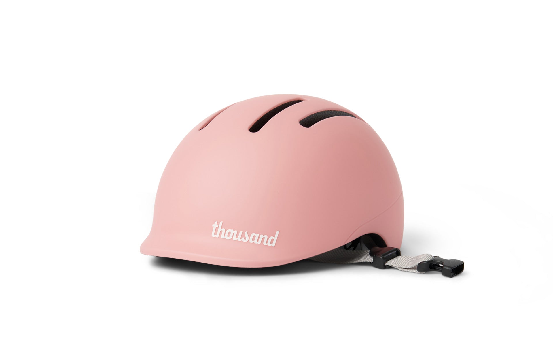 Pink helmet with 'thousand' branding on a white background