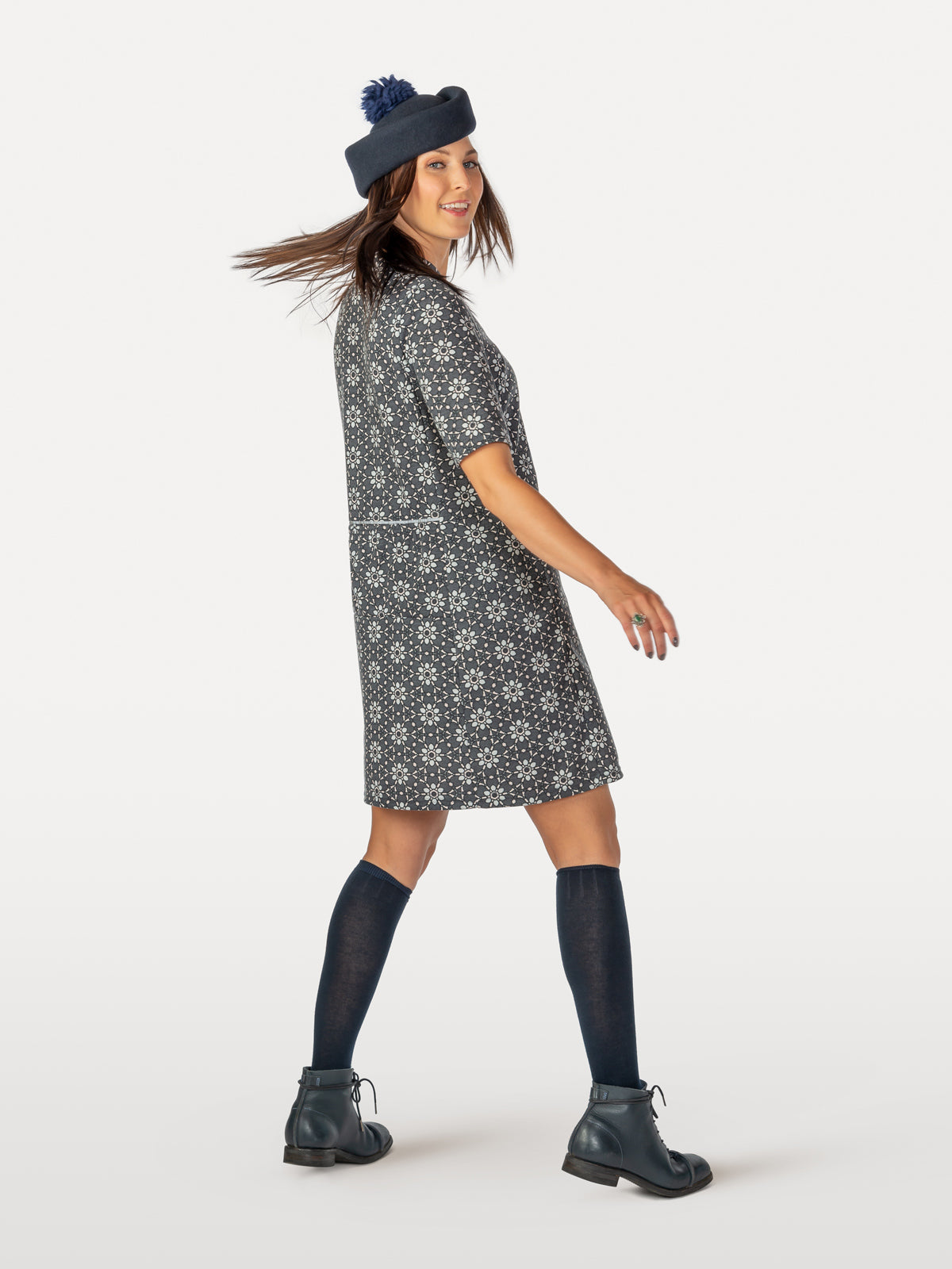 Fun cycling dress worn with accessories knee socks and stylish hat