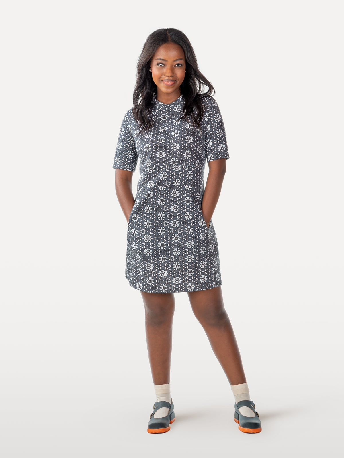 Daisies and heart-shaped patterned cycling dress with yellow buds on a blue-grey background